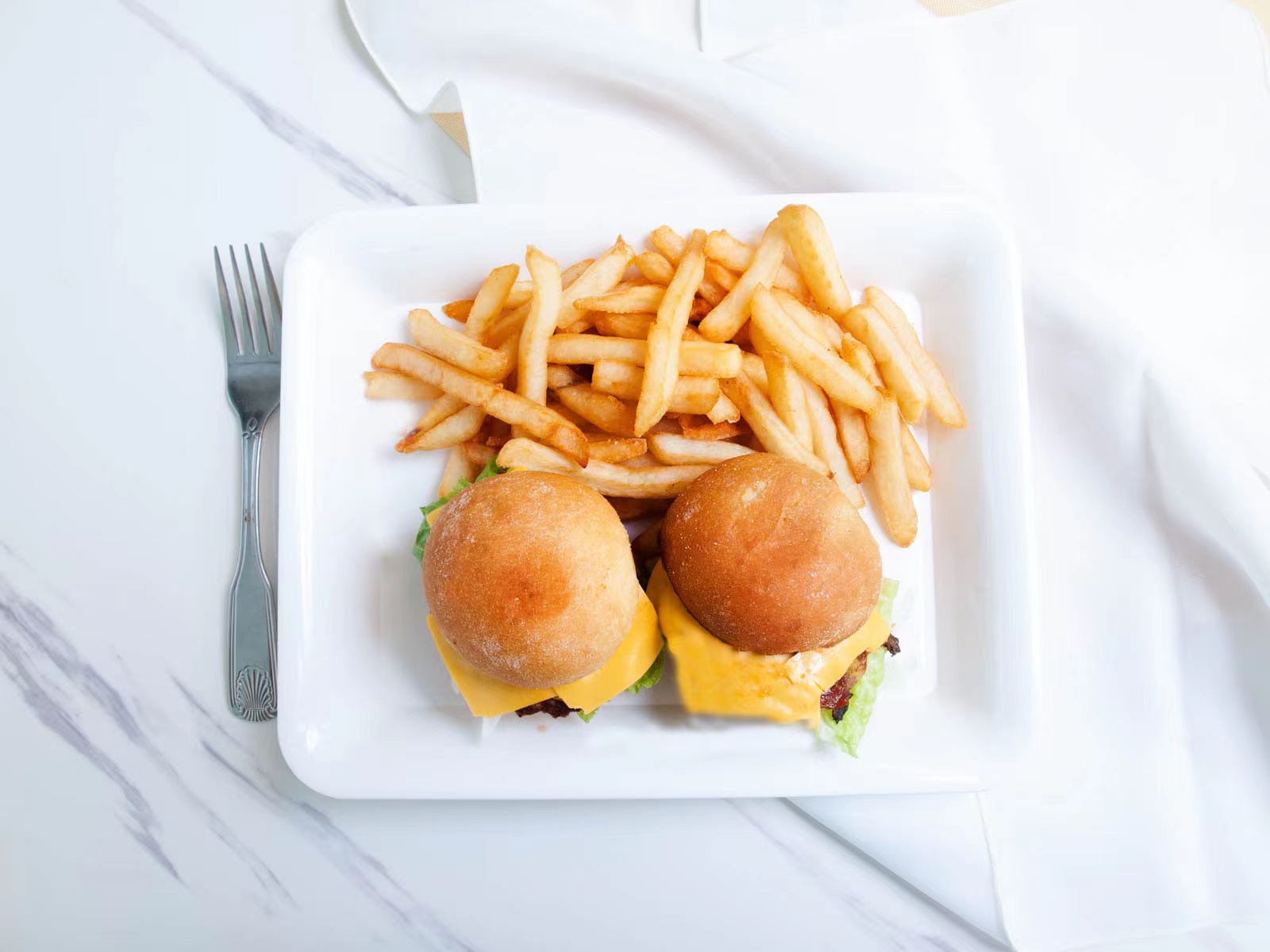 Two cheese mini sliders with crispy fries at M TOWN WING, a Chicken Wings Restaurant in Middletown