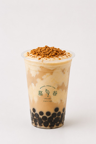 Crispy crumble taro boba milk tea with creamy layered base and black tapioca pearls at Muchun Isle & Tea, a Bubble Tea Shop in Bayside.