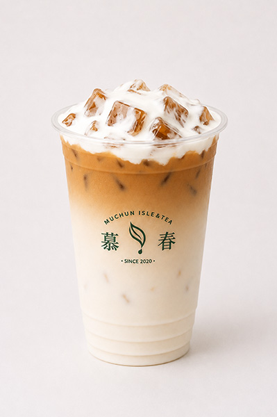 Two-tone iced milk tea with creamy white bottom, brown tea top, ice and thick cream foam layer at Muchun Isle & Tea, a Bubble Tea Shop in Bayside.