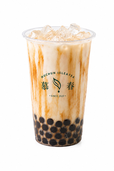 Classic brown sugar boba milk tea with vertical syrup streaks and black tapioca pearls at cup bottom at Muchun Isle & Tea, a Bubble Tea Shop in Bayside.
