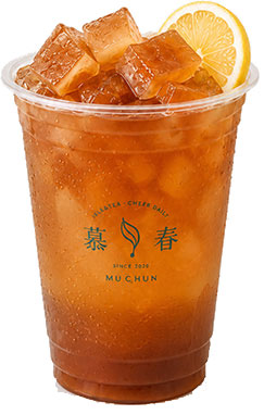 Refreshing iced black tea with clear ice cubes and fresh lemon slice garnish on branded plastic cup at Muchun Isle & Tea, a Bubble Tea Shop in Bayside.