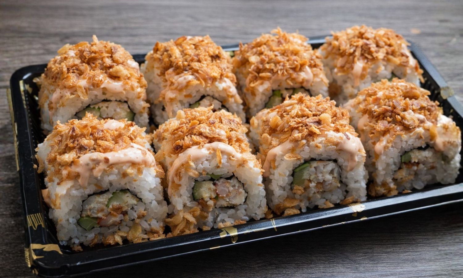 Crispy-topped sushi roll with veggies and sauce at Muy Bien Teriyaki, a Japanese Restaurant in El Monte