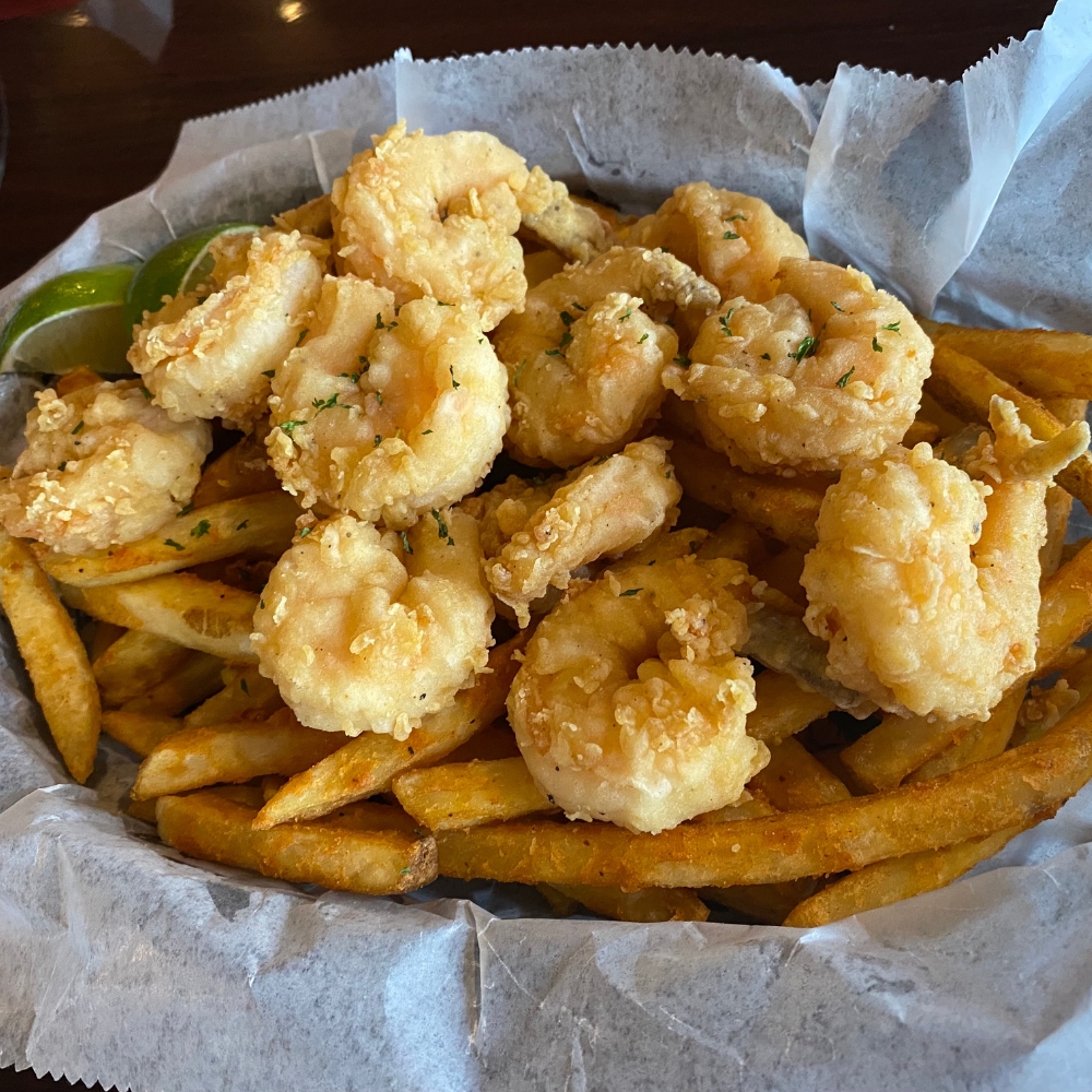 MY-CRAB-SPOT-Seafood-Restaurant-Fried-Shrimps-with-Fries-Syracuse Fried shrimps served with fries and lime at MY CRAB SPOT, a Seafood Restaurant in Syracuse