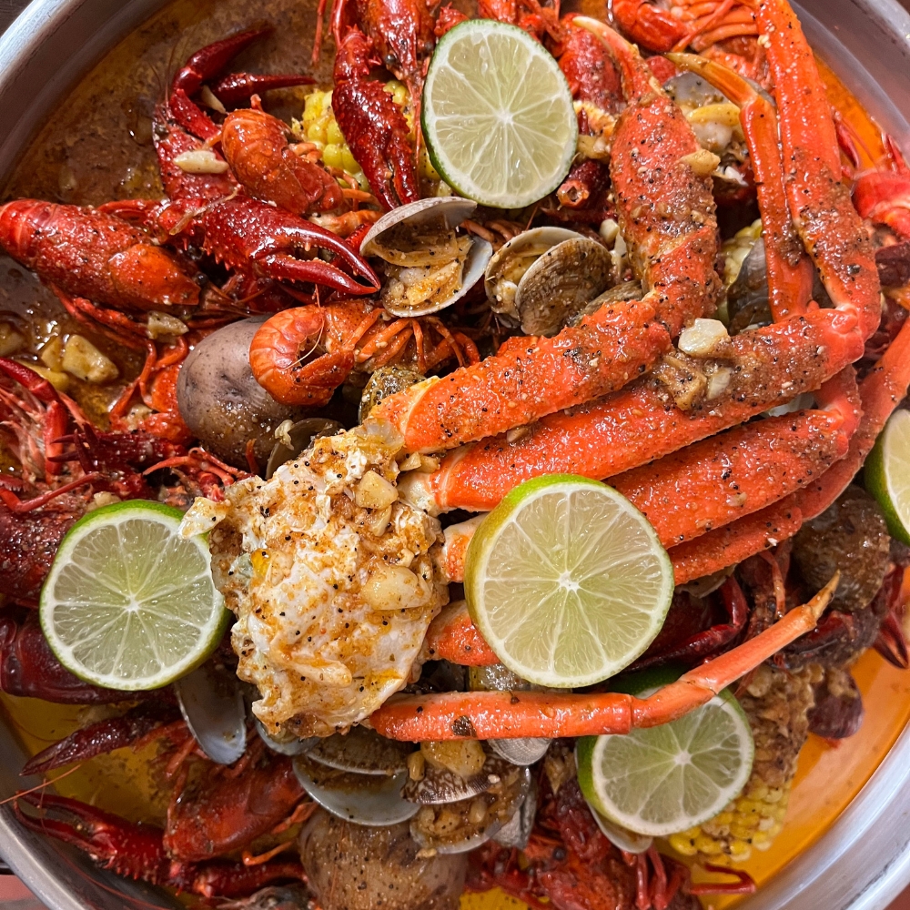 MY-CRAB-SPOT-Seafood-Restaurant-Seafood-Boil-Syracuse Seafood boil with crab legs, crawfish, clams, lime and spices at MY CRAB SPOT, a Seafood Restaurant in Syracuse