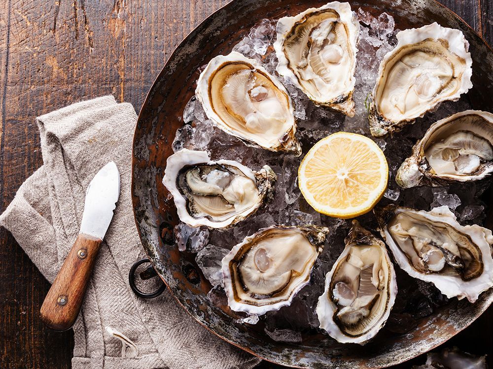 Fresh oysters on ice with lemon at Narumi Sushi, a Japanese Restaurant in Rancho Cordova