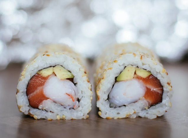 Two avocado and shrimp rolls, with visible shrimp and avocado inside