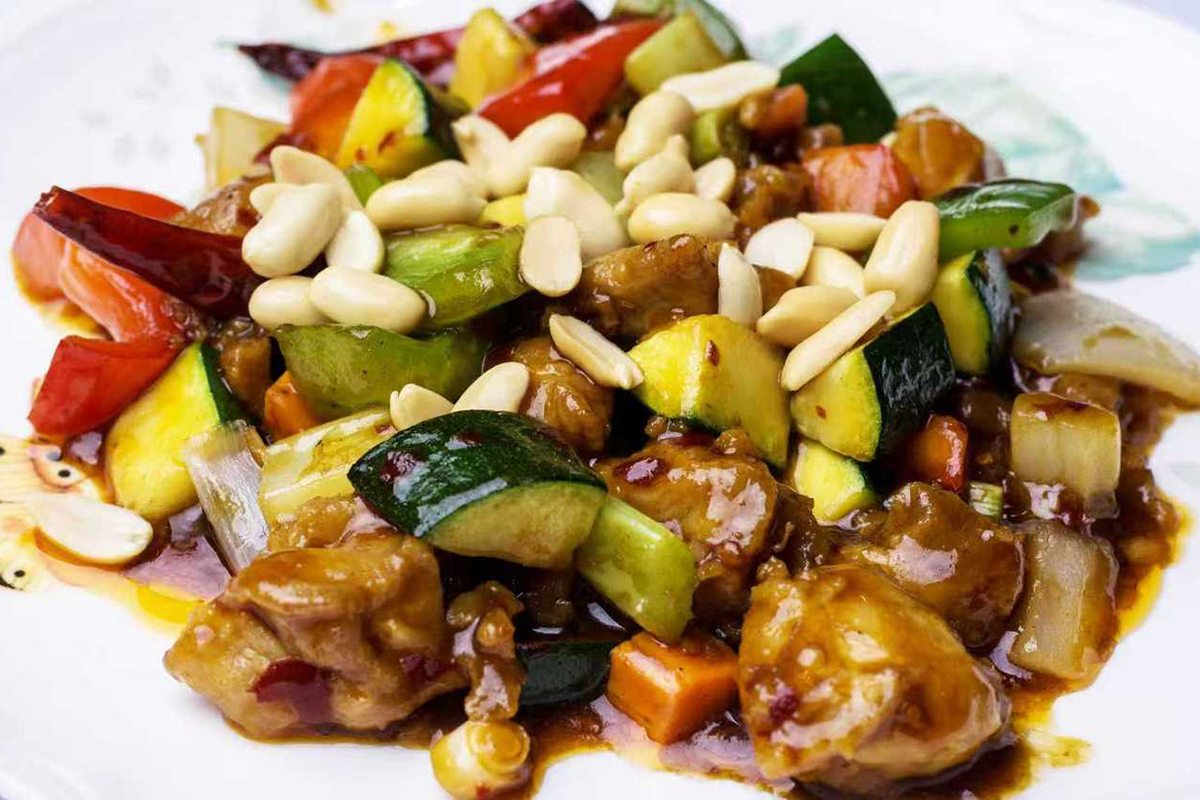 Kung Pao chicken with zucchini, carrots, red peppers, and peanuts in a spicy sauce at New China Two，a Chinese Restaurant in Redding