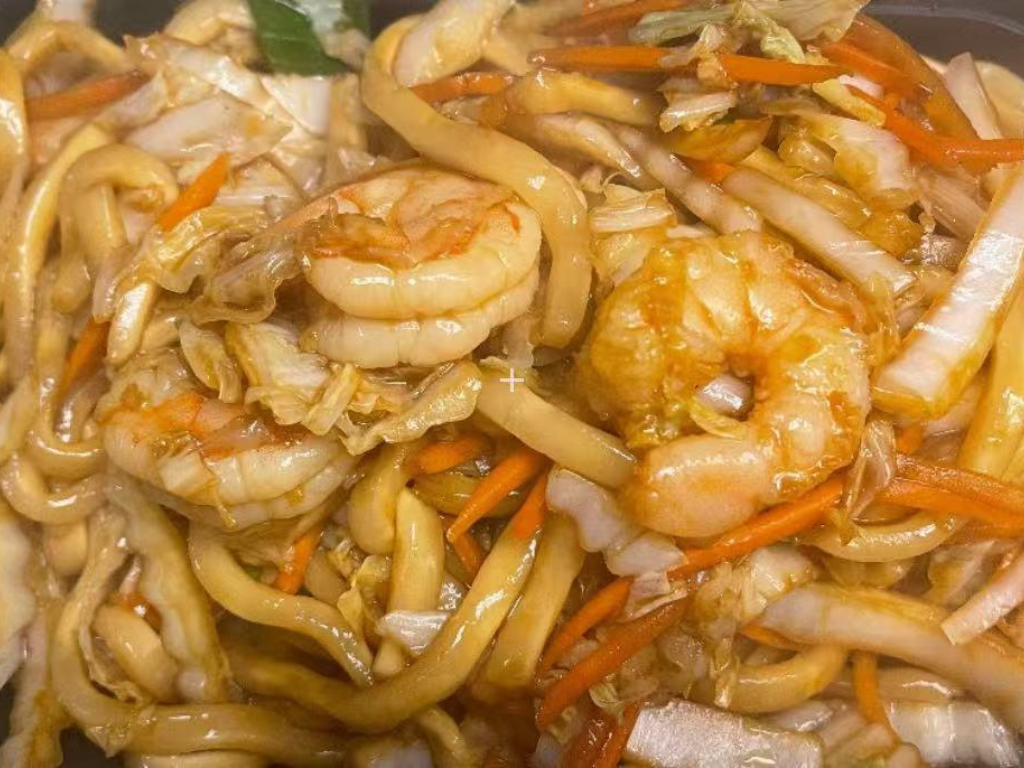 Stir-fried udon noodles with plump shrimp and veggies at New China City, a Chinese Restaurant in Roanoke