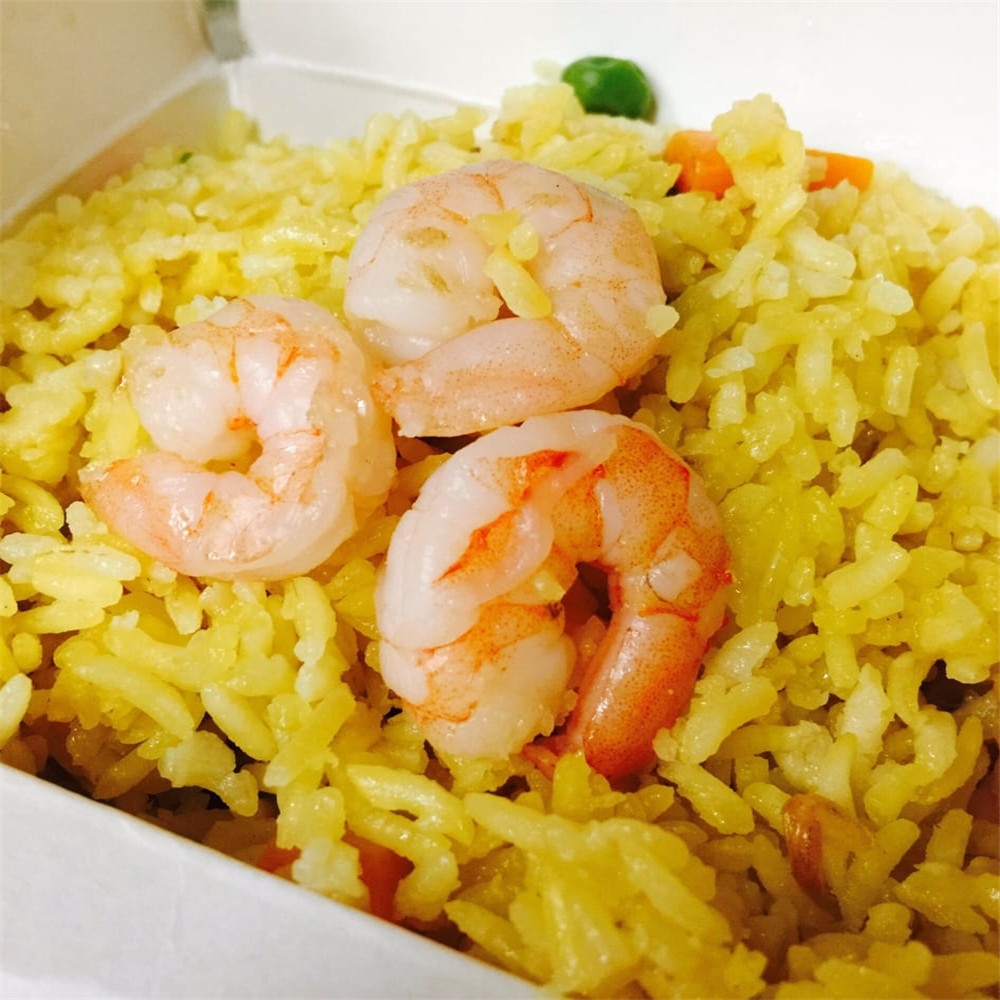 Yellow fried rice topped with plump shrimp at New China King, a Chinese Restaurant in Ardmore