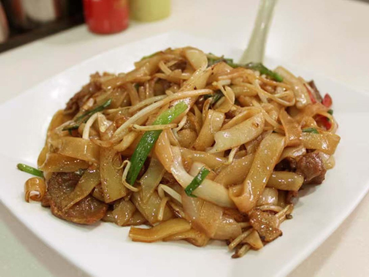 Wok - fried rice noodles with tender beef and fresh bean sprouts at New China Restaurant，a Chinese Restaurant in Lawrenceville