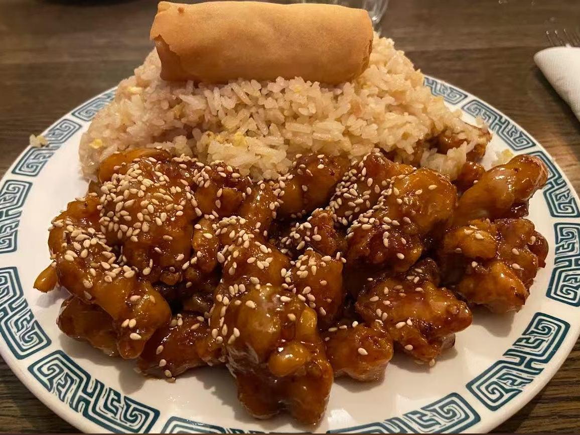 New-Chinatown-Restaurant-Chinese-restaurant-Sesame-Chicken-With-Rice-Jackson Fried rice paired with sesame - coated chicken and egg roll at New Chinatown Restaurant, a Chinese restaurant in Jackson
