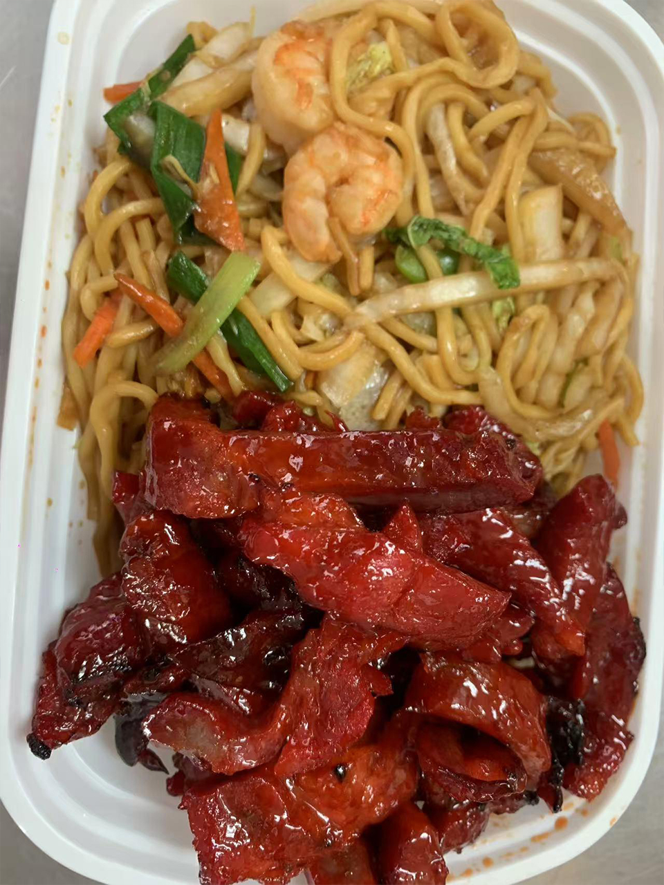 Boneless spare ribs with shrimp lo mein at New Empire Chinese Restaurant in Brooklyn