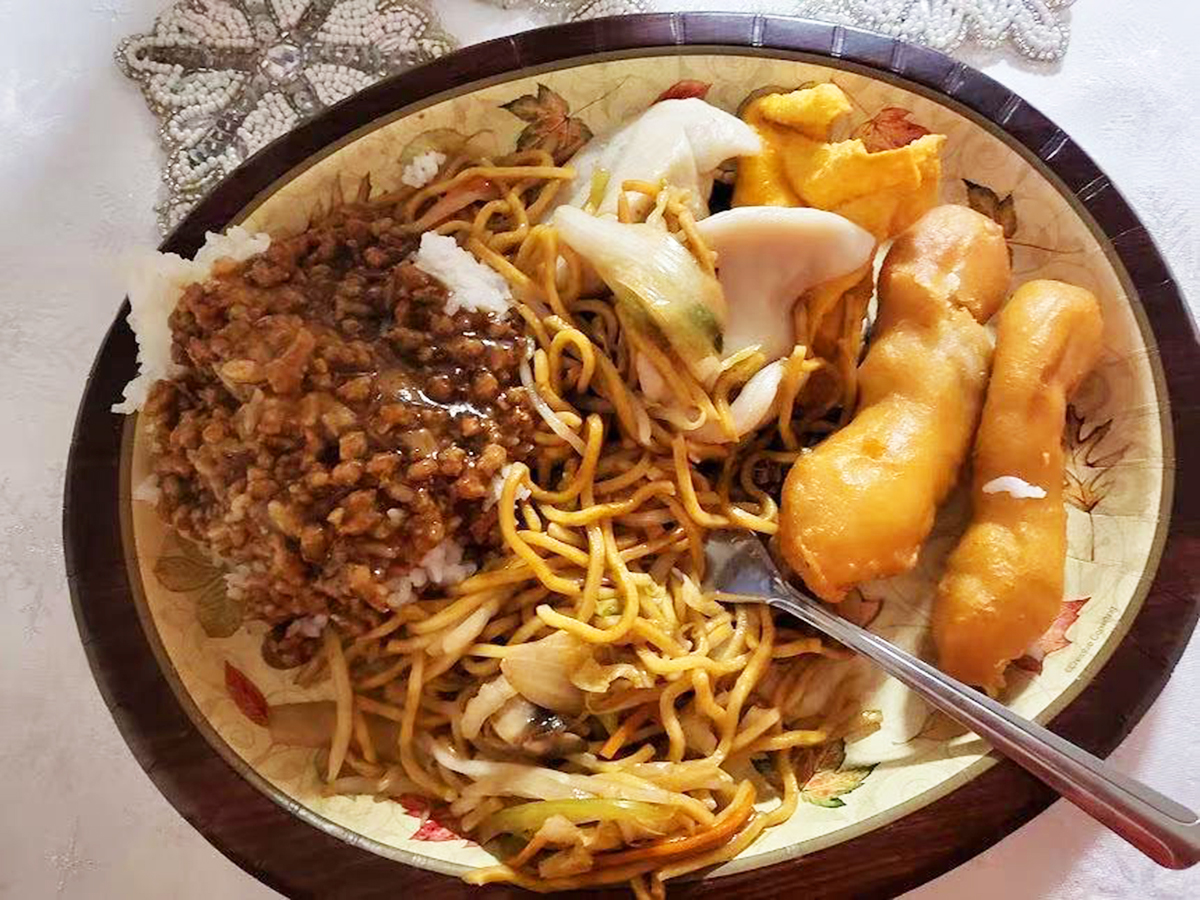 Plate with noodles, braised pork rice and fried dough sticks at New Golden Abacus, a Chinese Restaurant in Norwood