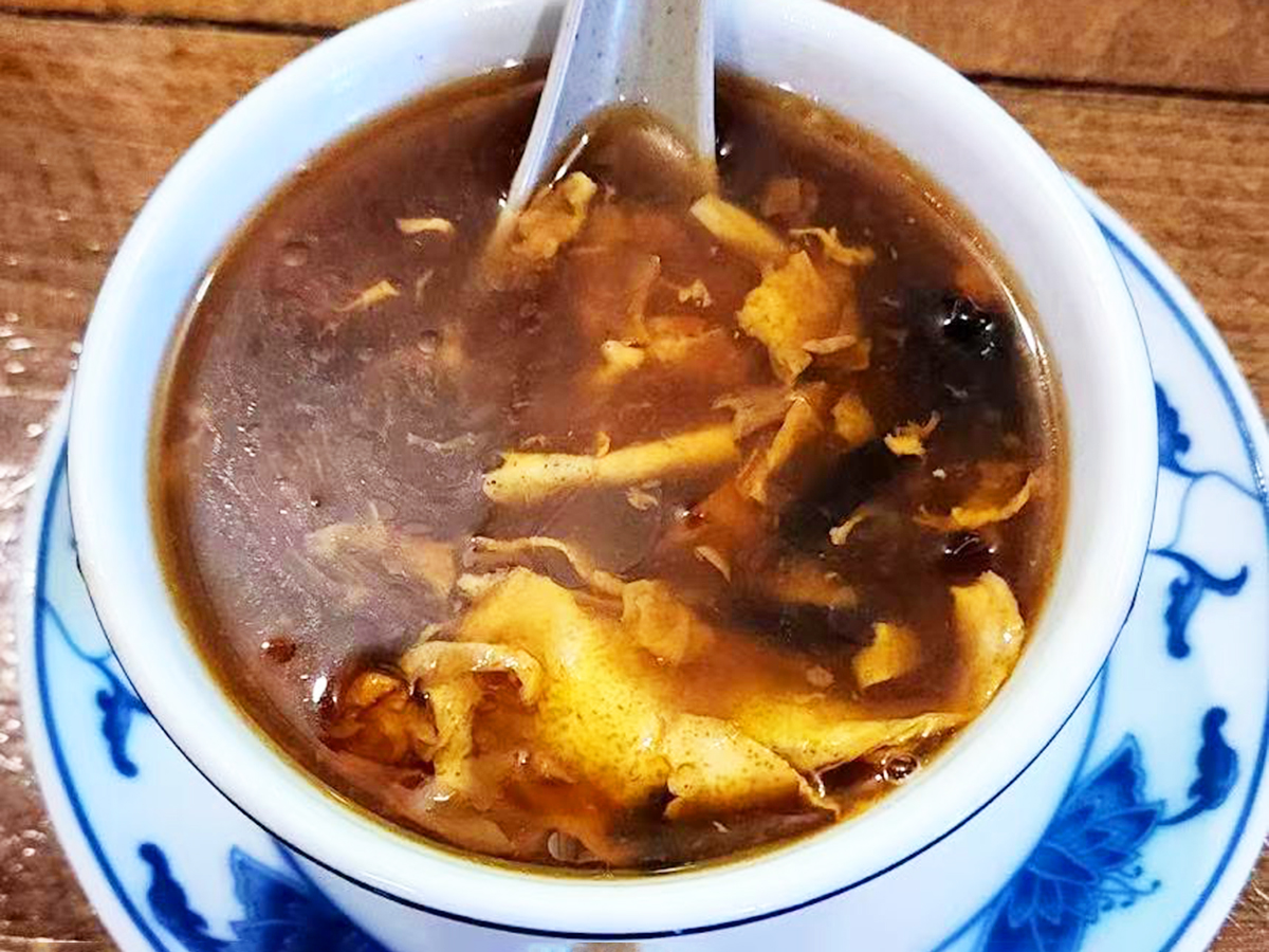 Bowl of hot and sour soup with vegetables at New Golden Abacus, a Chinese Restaurant in Norwood