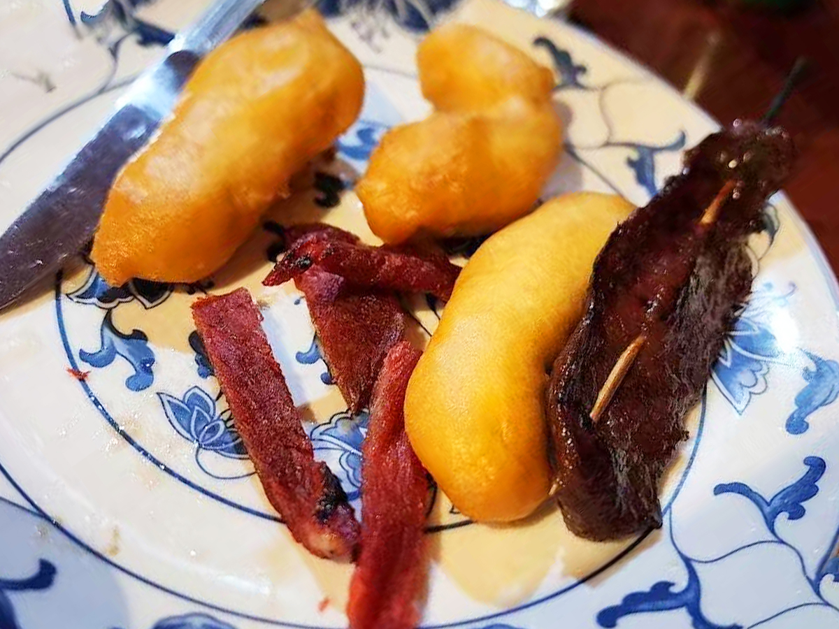 Plate with fried dough sticks and cured meat at New Golden Abacus, a Chinese Restaurant in Norwood