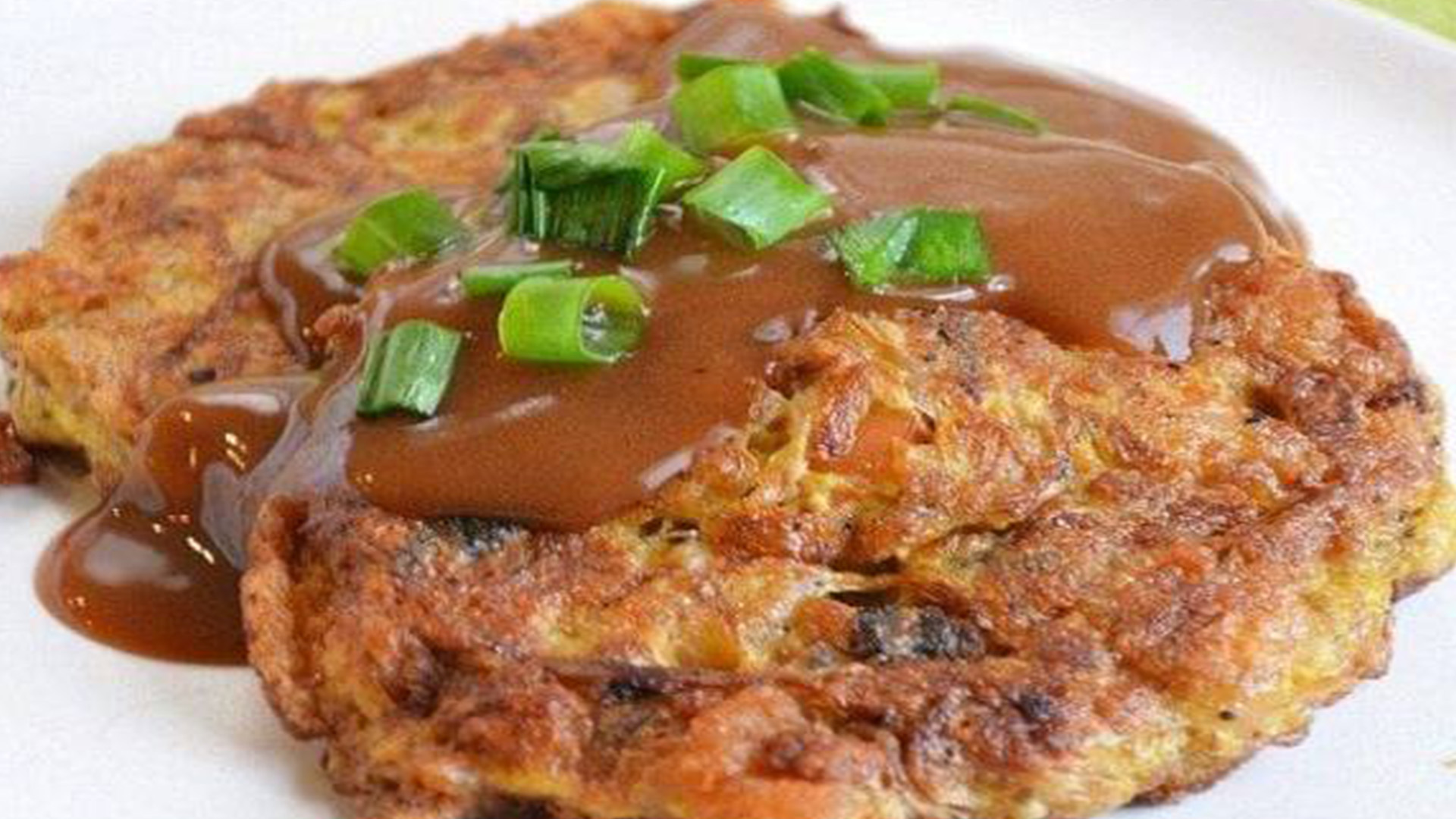 Beef egg foo young with brown sauce at New Great Wall, a Chinese Restaurant in Brooklyn