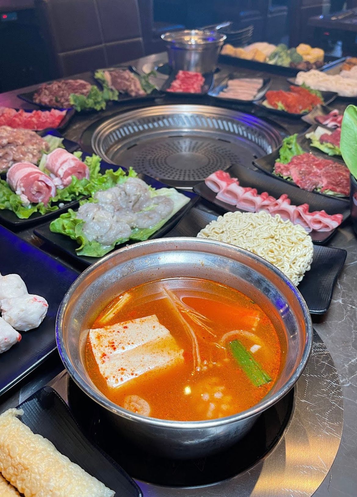 Spicy Hot Pot Broth with Tofu, Shrimp, and Noodles at Hi Pot, Hot Pot & Asian BBQ Restaurant in Pottstown