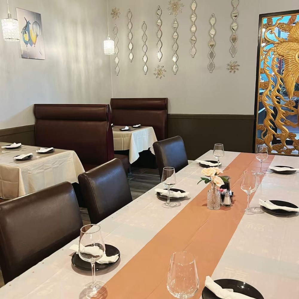 Another dining area with decorated walls and tables at New Imperial, a Chinese Restaurant in Easton.
