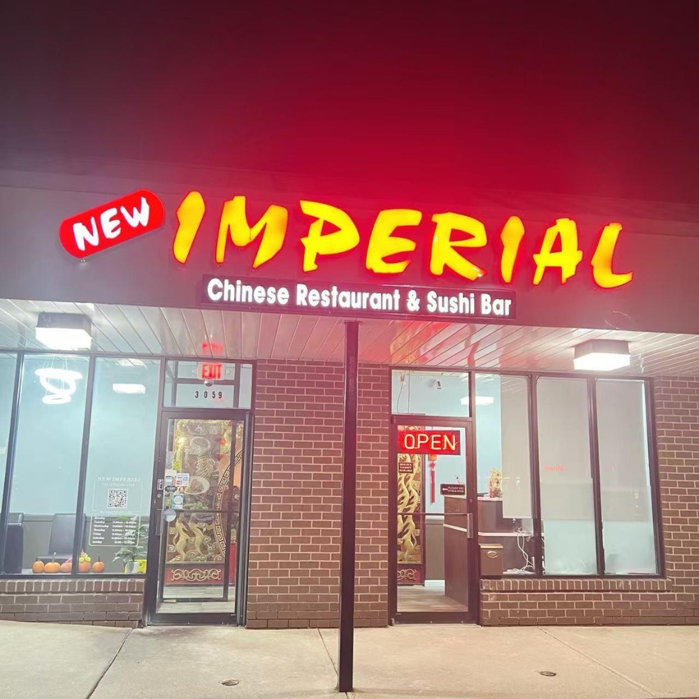 The exterior of New Imperial Chinese Restaurant & Sushi Bar at night in Easton.