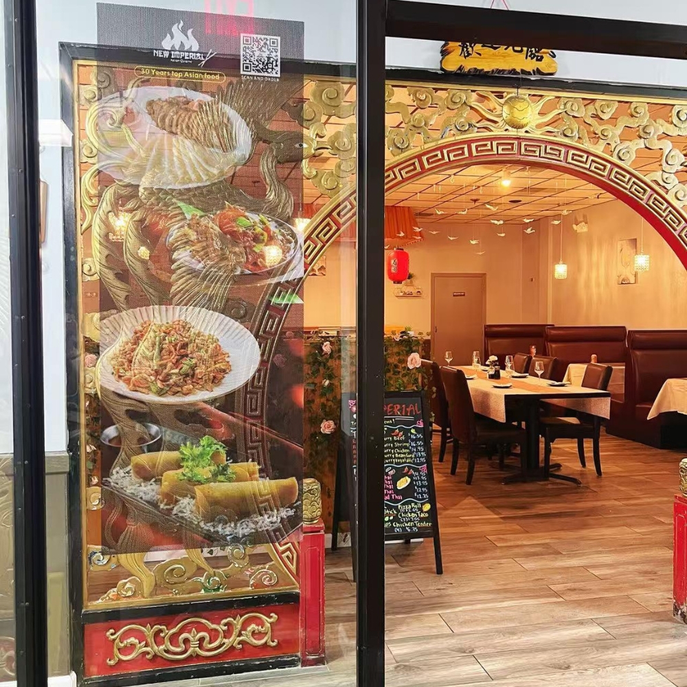 The entrance and interior view with food posters at New Imperial, a Chinese Restaurant in Easton.
