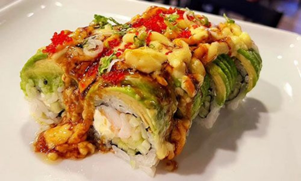 Avocado shrimp sushi roll with tobiko and sauce at New Ing's Palace, a Asian Restaurant in Burbank