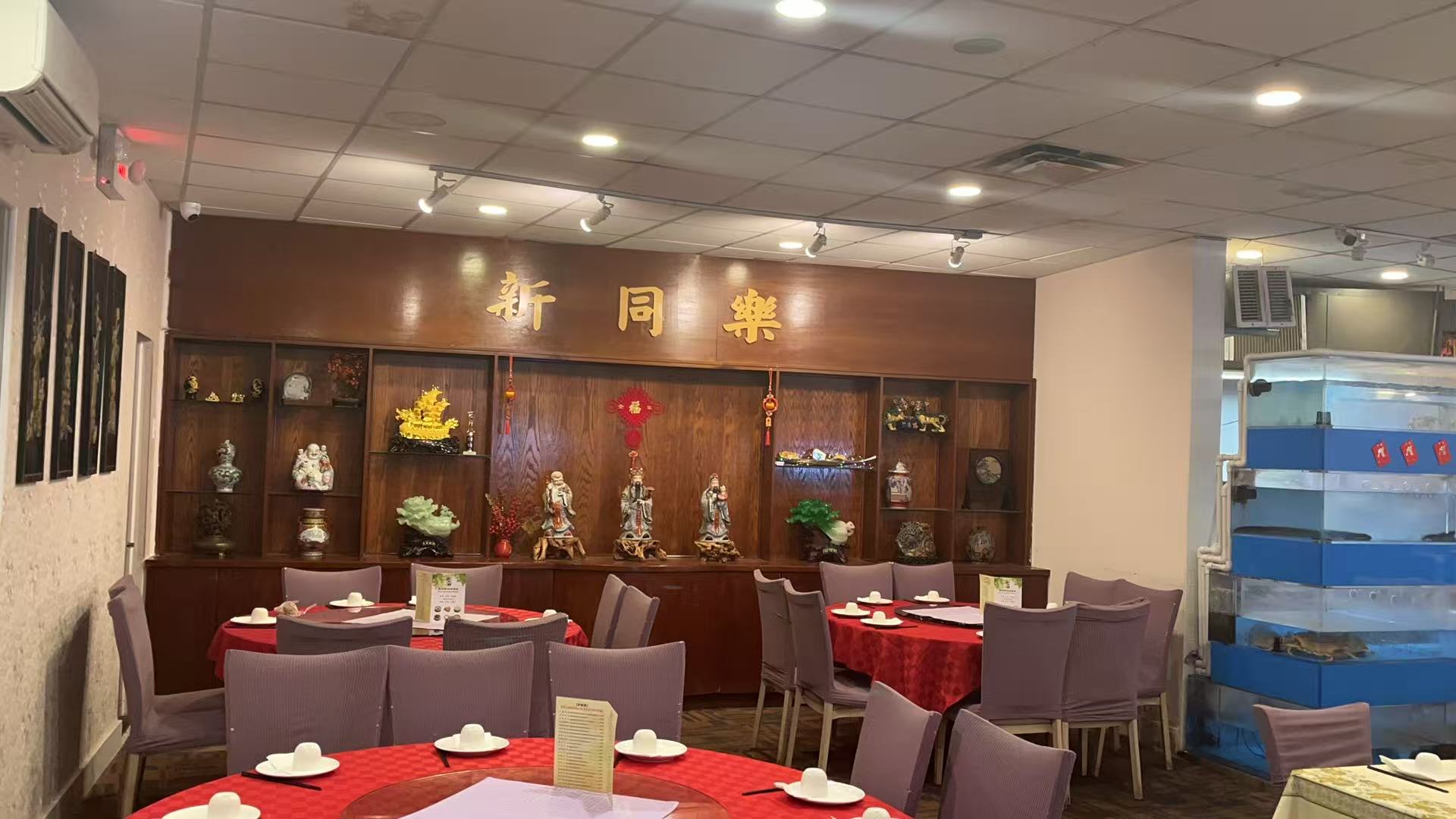 Elegant restaurant interior with New Northern Manor sign and decor at New Northern Manor, a Chinese Seafood Restaurant in Queens
