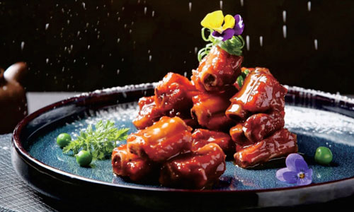Glazed sweet-and-sour ribs with edible flowers at New Shanghai No. 1, a Chinese restaurant in San Gabriel