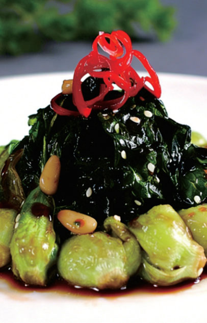 Seasoned leafy greens with sesame and chili garnish at New Shanghai No. 1, a Chinese restaurant in San Gabriel