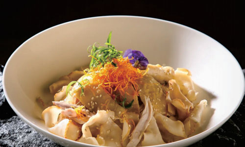 Marinated sliced seafood with edible flower garnish at New Shanghai No. 1, a Chinese restaurant in San Gabriel