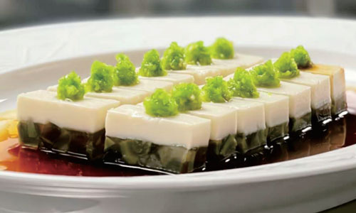 Two-layer preserved egg tofu cubes with green garnish at New Shanghai No. 1, a Chinese restaurant in San Gabriel