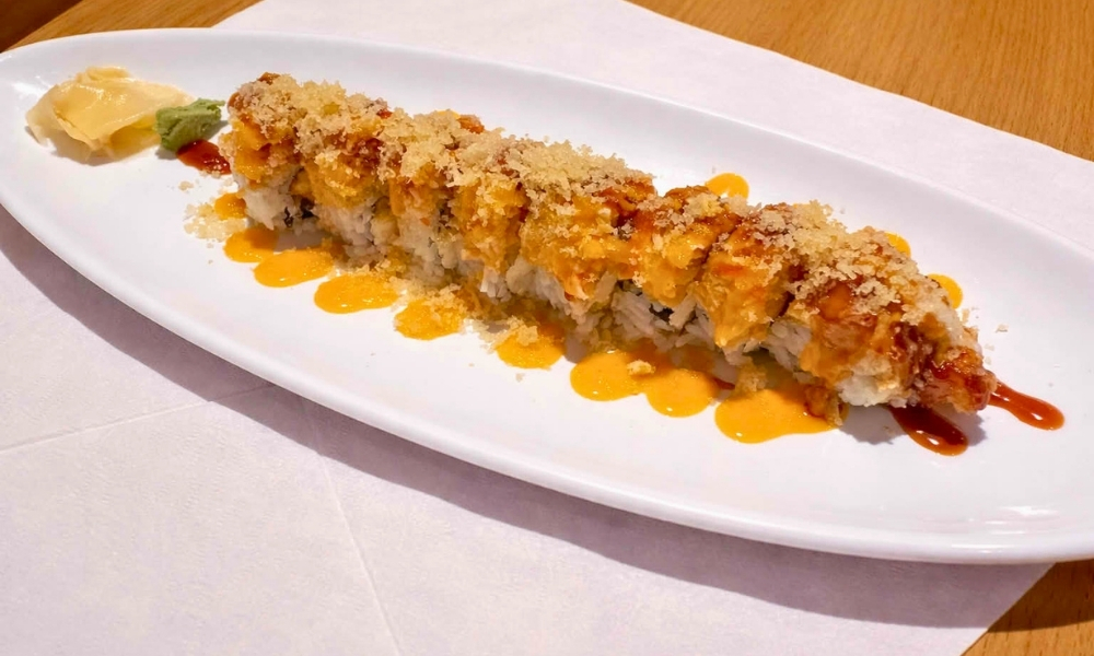 Background-Crunchy tempura roll with crispy flakes and two sauces at New Tokyo & Ichiban Japanese Grill, a Japanese Restaurant in Tupelo