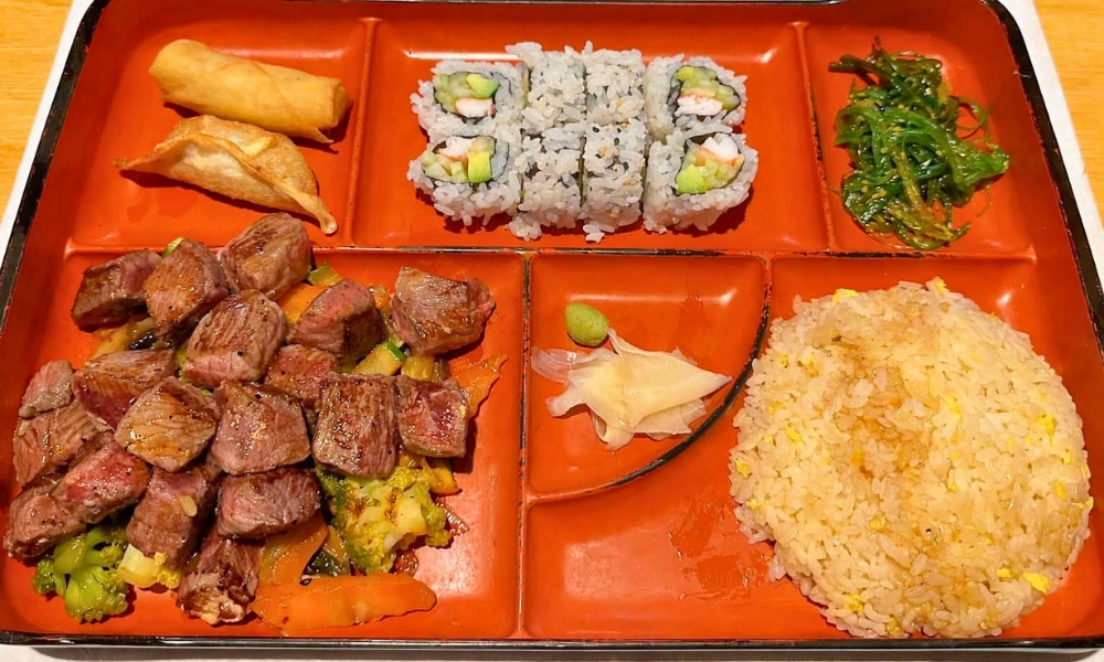 Steak bento box with sushi, spring rolls, and fried rice at New Tokyo & Ichiban Japanese Grill, a Japanese Restaurant in Tupelo
