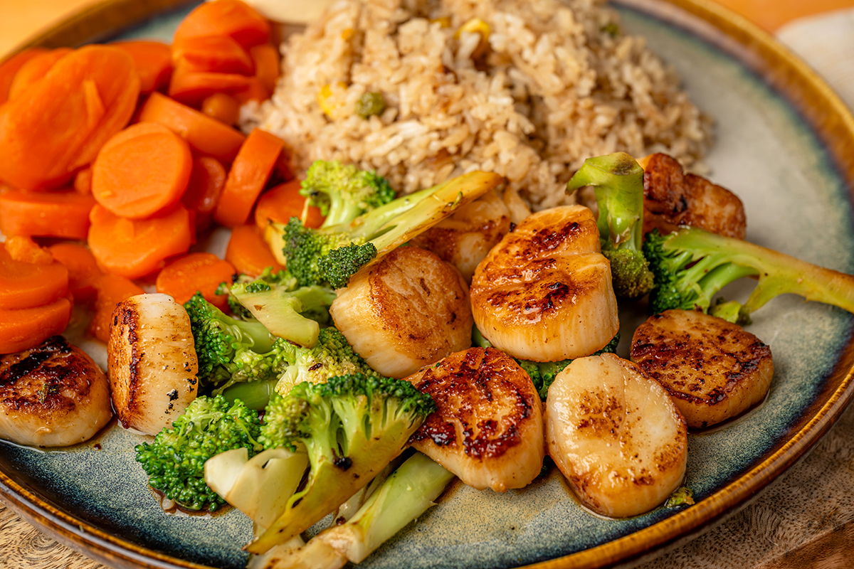Seared scallops with broccoli carrots and fried rice at New Yamazato, a Japanese Hibachi Restaurant in Rocky Mount