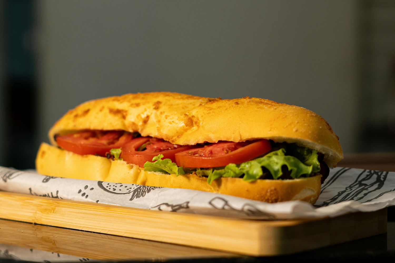 Toasted sub sandwich with fresh tomato and lettuce filling at NEW YORK BUFFALO WINGS, a American restaurant in Forest Park