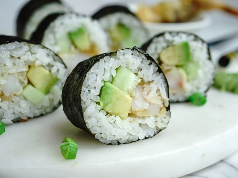 Shrimp and avocado sushi rolls on a white plate at Ninja Cafe - Kung Fu Tea, a Bubble Tea Store in High Point