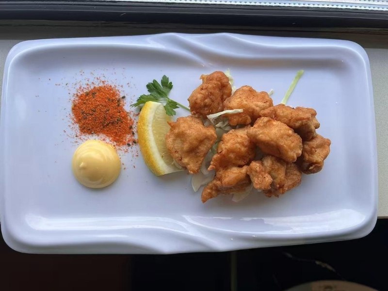 Japanese fried chicken (karaage) with lemon, mayo, and spice at Ninja Ramen, a Japanese Restaurant in Englewood