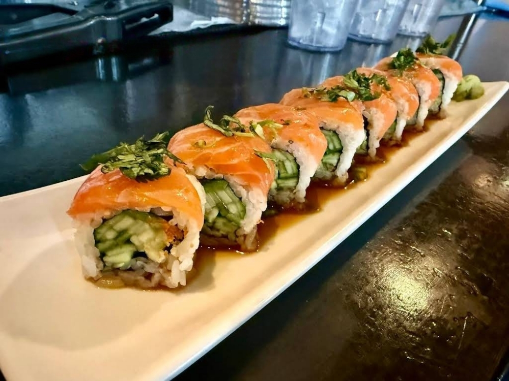 Salmon sushi roll with cucumber and sauce at Nobu Sushi, an Sushi Restaurant in South Elgin.