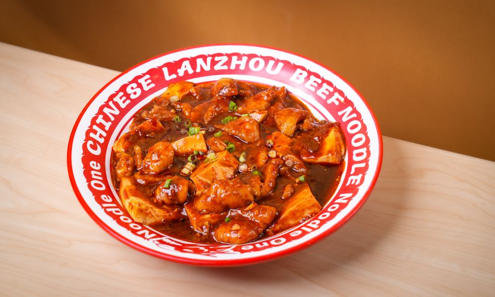 Tender beef & tofu simmered in bold spicy sauce at Noodle One, a Halal Restaurant in Frisco