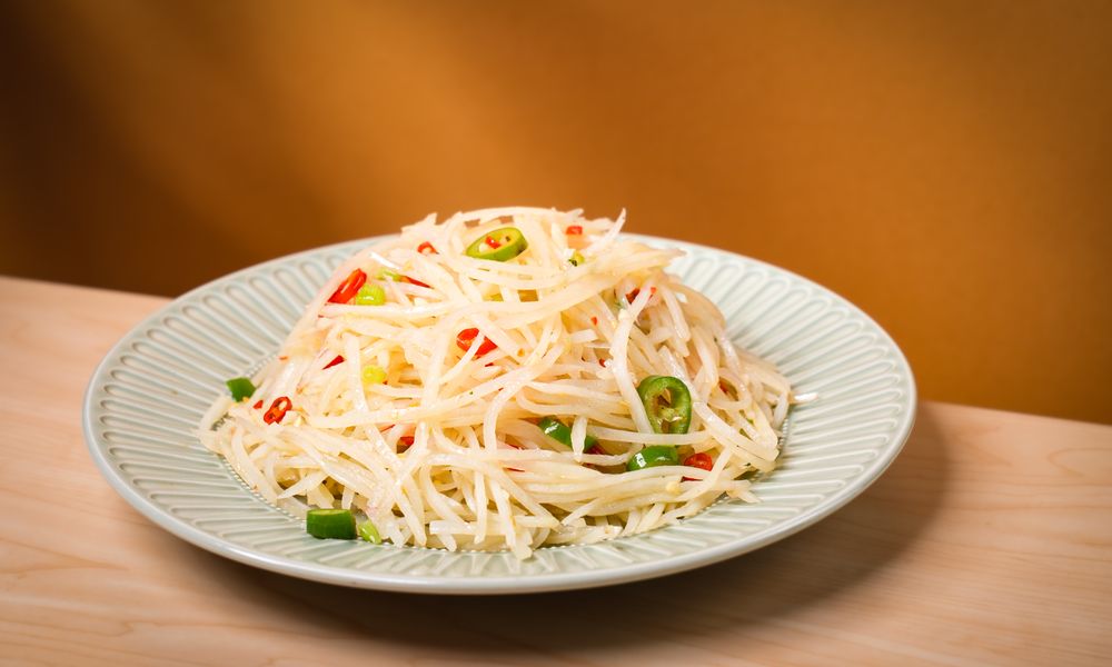 Crunchy potato shreds in tangy, spicy dressing at Noodle One, a Halal Restaurant in Frisco