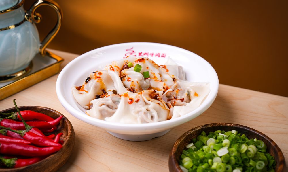 Tender wontons tossed in bold chili oil sauce at Noodle One, a Halal Restaurant in Frisco