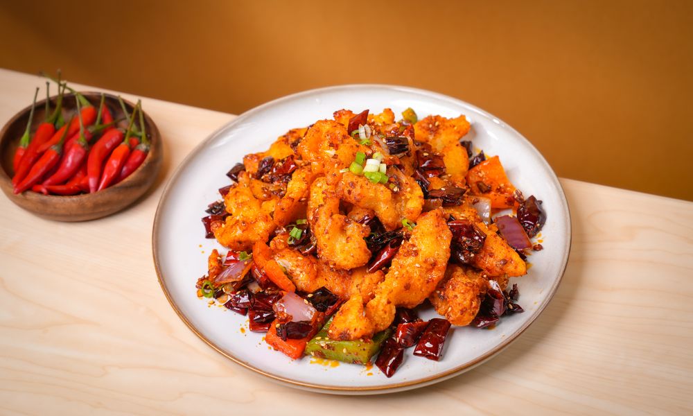 Crispy chicken tossed in bold spicy seasoning at Noodle One, a Halal Restaurant in Frisco