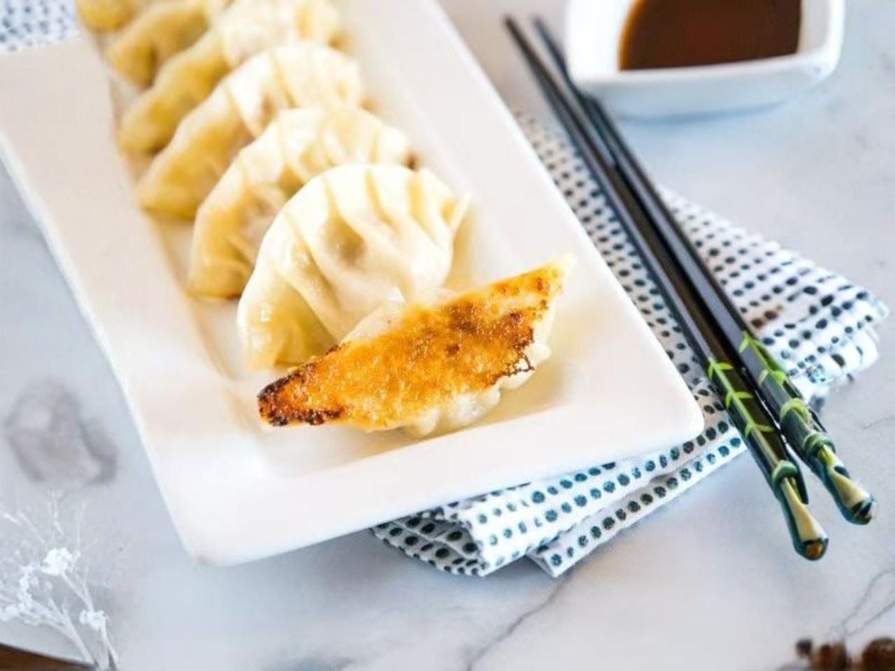 Pan-fried pork gyoza with soy dipping sauce at Nori Hibachi Sushi, a Japanese Restaurant in Mt. Juliet