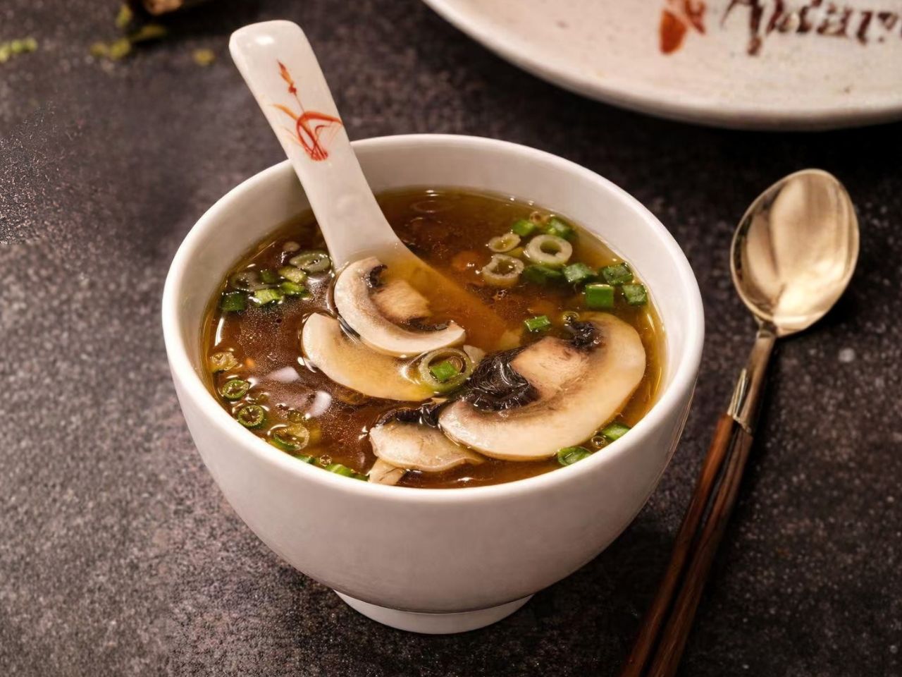 Savory miso soup with mushrooms and green onions at Nori Hibachi Sushi, a Japanese Restaurant in Mt. Juliet