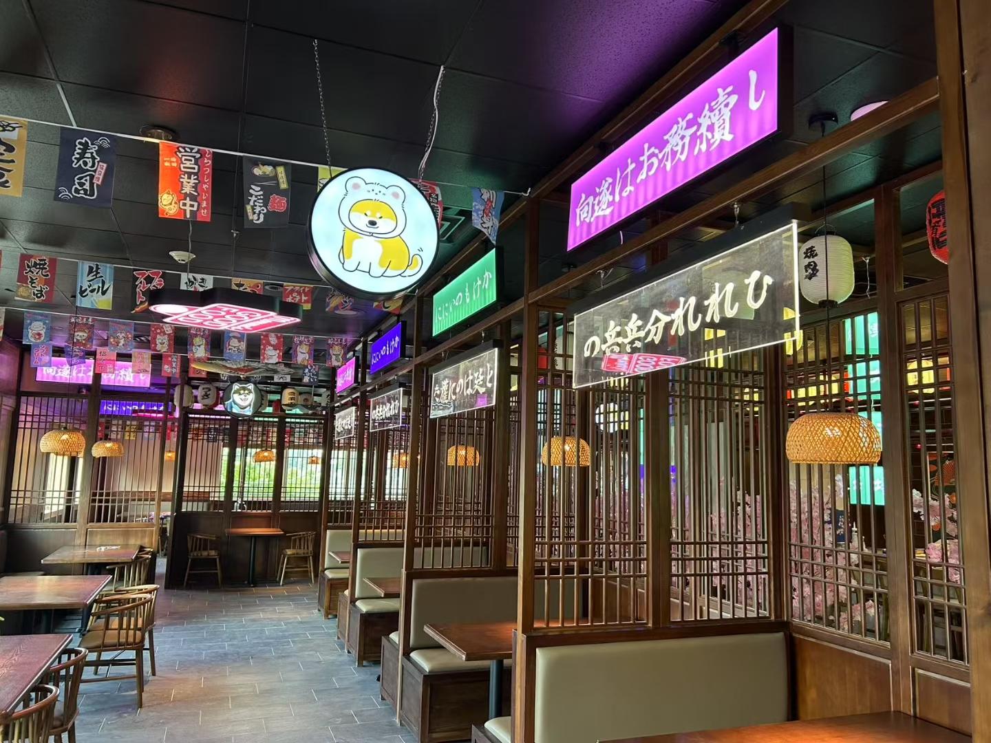 Noriya-Japanese-Cuisine-Restaurant-Vibrant-Interior-Decor-Decatur Vibrant interior of Noriya with neon signs and Japanese banners at Noriya Japanese Cuisine, a Japanese Restaurant in Decatur