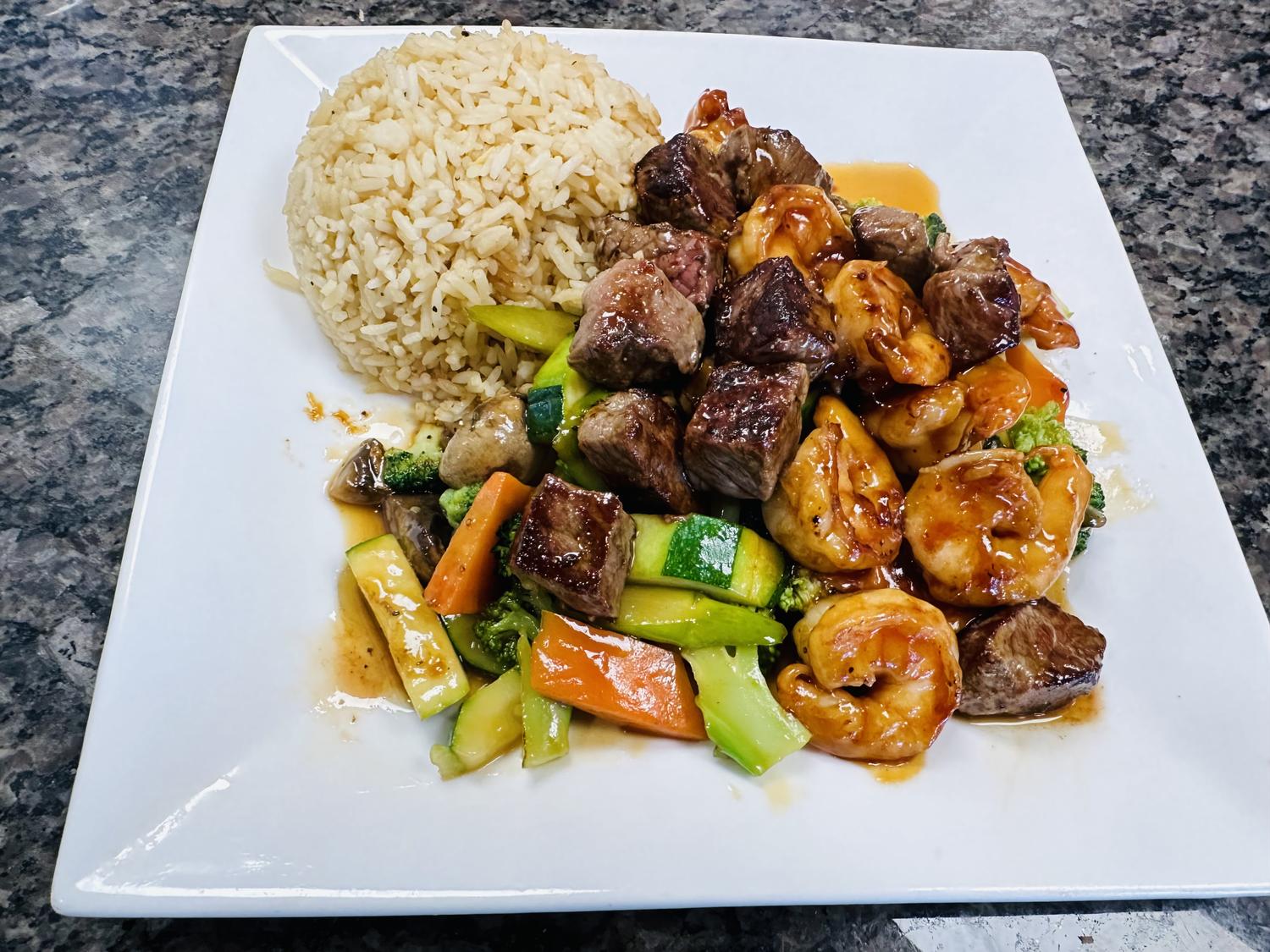 Noriya-Japanese-Cuisine-Restaurant-Surf-and-Turf-with-Rice-Decatur Surf and turf (beef and shrimp) stir - fry served with brown rice at Noriya Japanese Cuisine, a Japanese Restaurant in Decatur