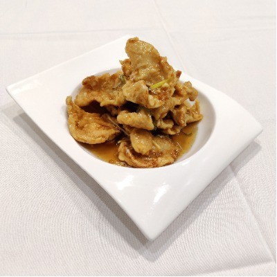Northeast style guo bao rou in sweet‑sour sauce with scallion.