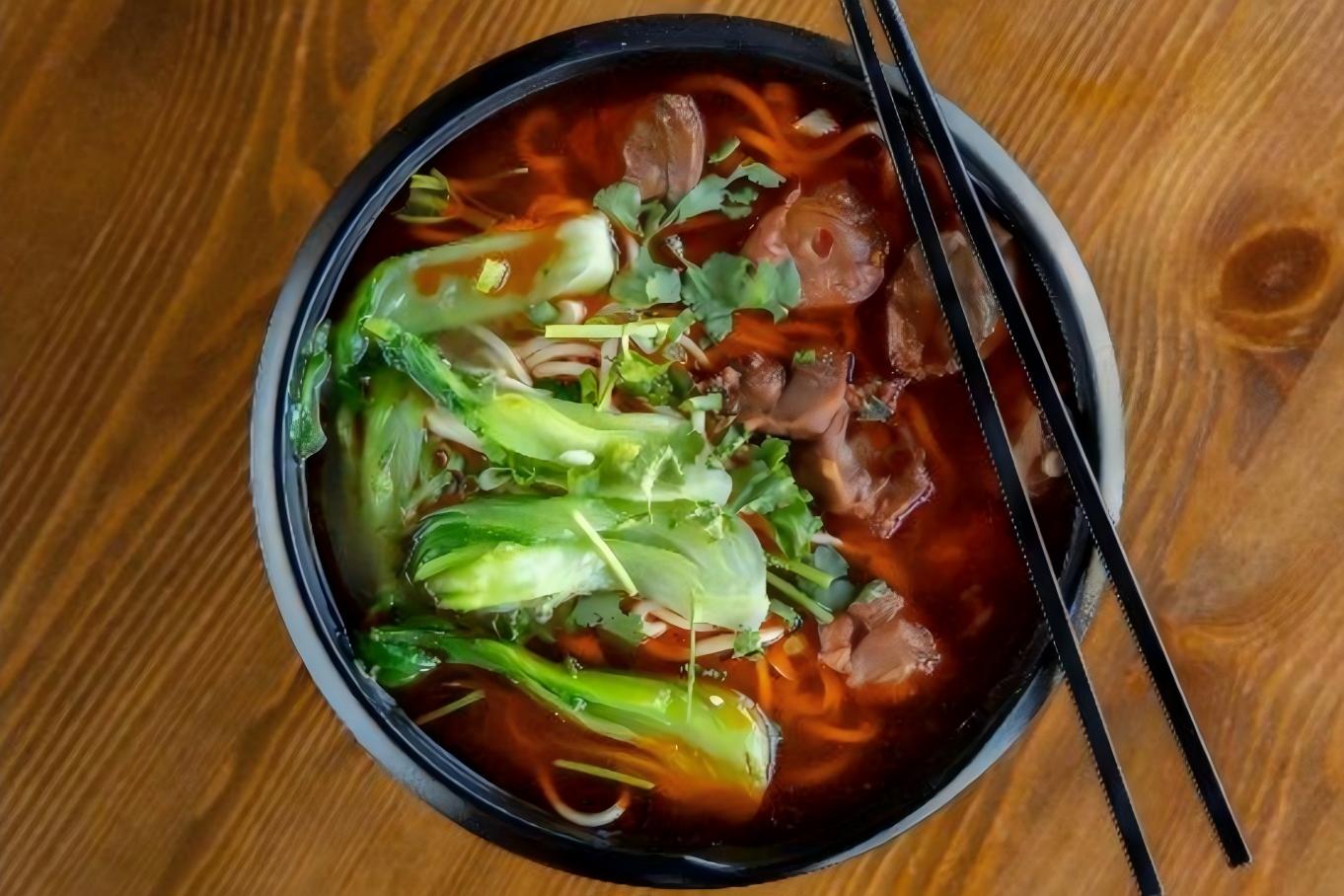 Spicy beef offal noodle soup with bok choy and cilantro at Northern Cafe, a Chinese Restaurant in CA