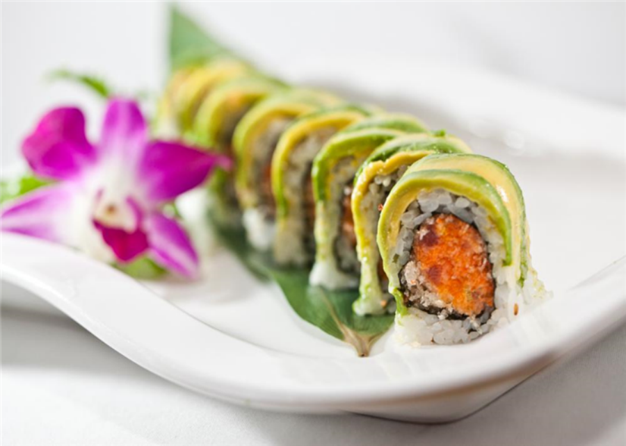 Avocado wrapped spicy salmon sushi roll at Ocha Asian-Japanese Cuisine，a Asian Restaurant in Caldwell
