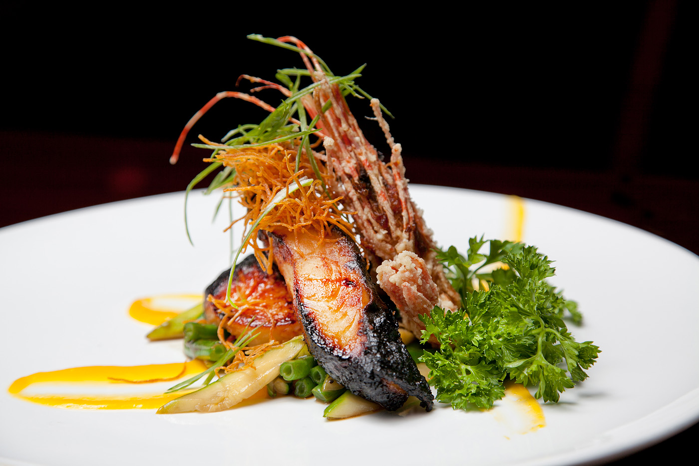 Elegant plated grilled seafood with seasonal vegetables at Ocha Asian-Japanese Cuisine，a Asian Restaurant in Caldwell