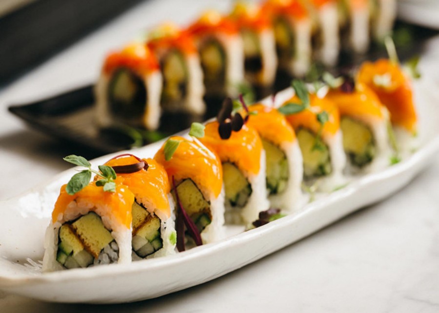 Salmon topped delicate sushi roll platter at Ocha Asian-Japanese Cuisine，a Asian Restaurant in Caldwell